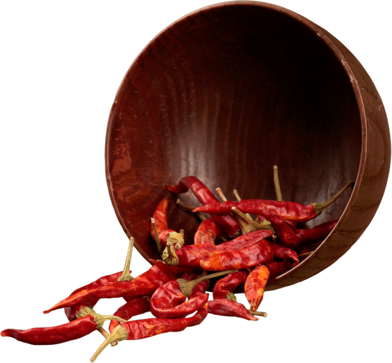 Dried Chili Peppers Falling Out of a Bowl